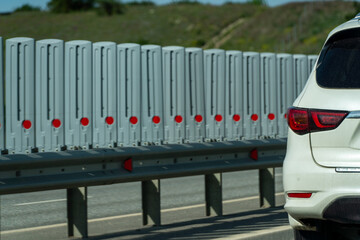 Safety barriers on highway. Anodized safety steel barrier. Enhancing highway safety.