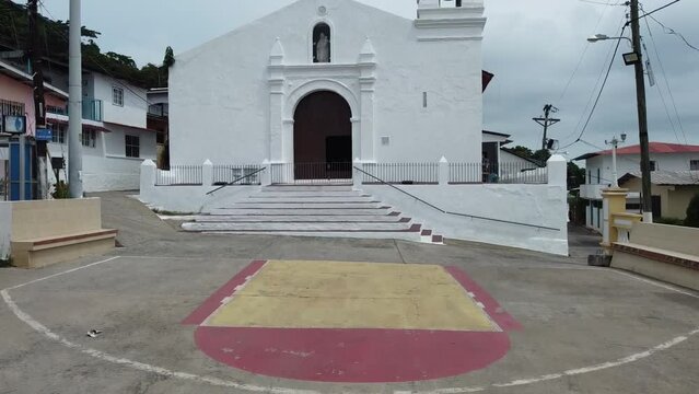Aerial drone image: Church and small historical village in Panamenian island on pacific ocean, Taboga Island Panama