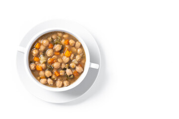 Chickpeas soup with vegetables in bowl isolated on white background. Top view. Copy space