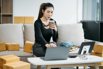 Young asian Woman Thinking and Working on sell online in cozy house, Modern Lifestyle of New Generation People.