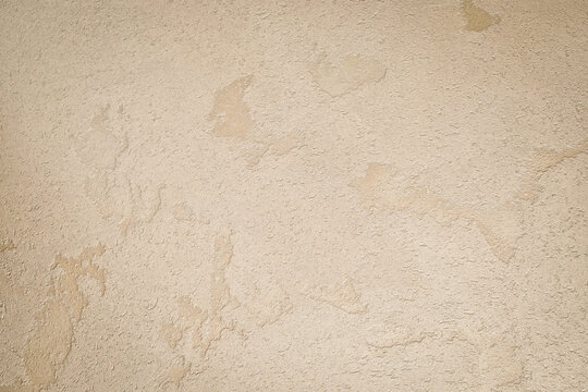 Light brown textured concrete background. Space for text. Textured surface.
