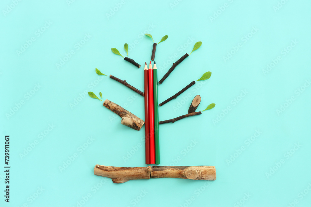 Wall mural top view image of pencil and tree concept. idea of education, creativity, and growth