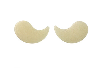 Gold hydrogel eye patches isolated on white background
