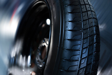 Close-up of a car tire and wheel