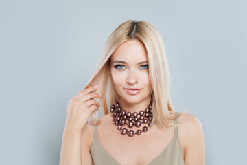 Beautiful fashion jewelry model woman. Lady with fresh clean skin, blonde hair and pearl necklace...