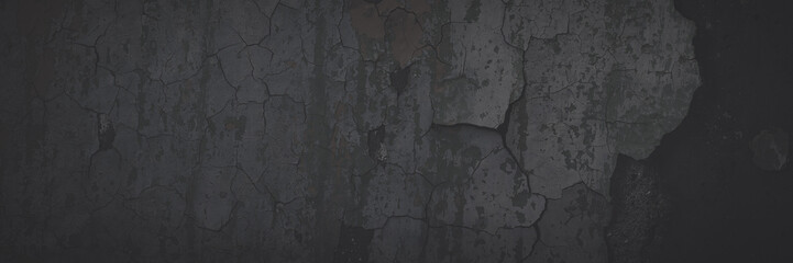 Dark wide panoramic background. Peeling paint on a concrete wall. Faded dark texture of old cracked...