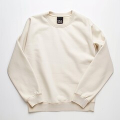 Beige color crew-neck sweatshirt lying flat and folded on top of a white background