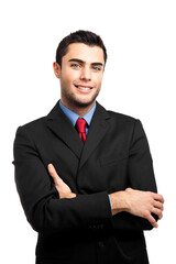 Confident businessman smiling with arms crossed