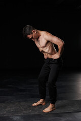Male yoga practitioner demonstrates the benefits of abdominal vacuum for a healthier lifestyle