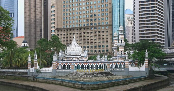 River of Life, Kuala Lumpur, Malaysia, Masjid Jamek, a historic mosque Kuala Lumpur. Masjid Jamek Sultan Abdul Samad Mosque at the confluence of two rivers in Kuala Lumpur. A city landmark.