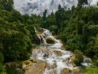 Tropical mountain forest with beautiful waterfalls. Aliwagwag Falls. Mindanao, Philippines.
