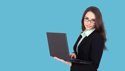 Young happy woman holding laptop computer