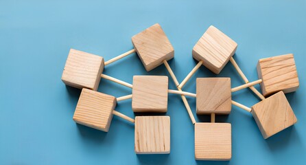 Wooden blocks connected together on a blue background. Teamwork concept