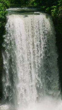 First falls among the Seven Falls in Lake Sebu. Hikong Alo. Mindanao, Philippines. Slow motion. Vertical view. Travel concept.