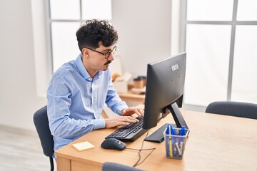 Young caucasian man business worker using computer working at office
