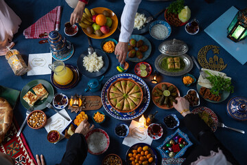 Ramadan Iftar Table. Muslim Family Having Dinner At Home. Iftar Table with Traditional Food....