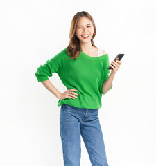 Beautiful Asian woman wear an green shirt and holding smartphone and smiling on white background.