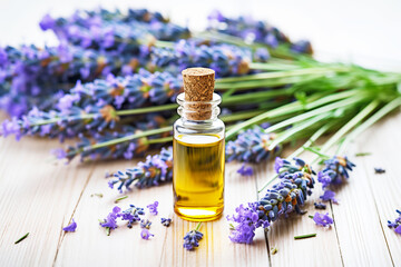 lavender flowers next to dropper bottle of essential oil