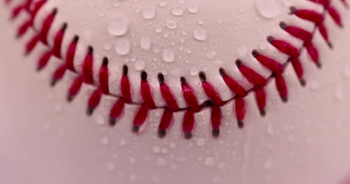 white baseball ball tied with red thread, a real round baseball ball close-up