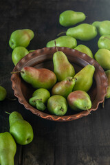 Parisian pear variety. Fruits on the table. Autumn harvest. Pears top view background. Green yellow red color pear. Vitamin vegan food.