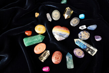 Gemstones minerals stones and obelisks on velvet background. Witchcraft, herbal medicine and...
