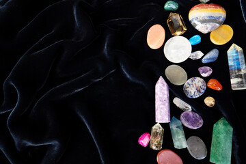 Gemstones minerals stones and obelisks on velvet background. Witchcraft, herbal medicine and...