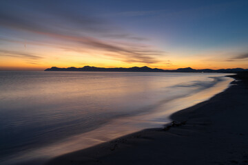 Fototapeta na wymiar view of the endless beach at Playa del Muro in Alcudia just before sunrise
