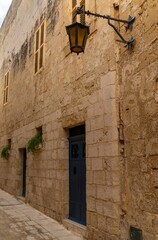 typical yellow-ochre limestone buildings in the old town of Mdina in Malta