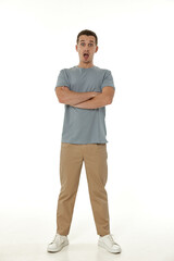 Fototapeta premium surprised guy looking at camera on white studio background
