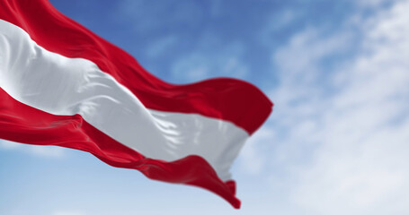 The national flag of Austria waving on a clear day