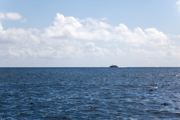 Obraz premium View of the sailing passenger boat on the sea