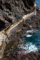 View of the footpath at the seaside cliff on a sunny day