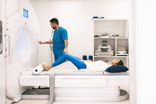 Medical professional operating an MRI machine