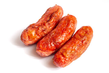 Three fried meat sausages on a white background. With a shadow.