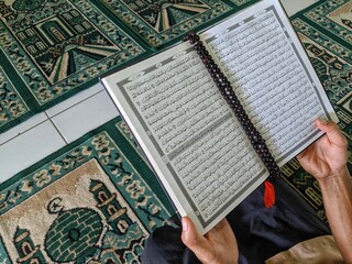 young men read the Koran in the mosque in the holy month of Ramadan
