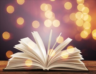 Open old Book With magic Glowing light
