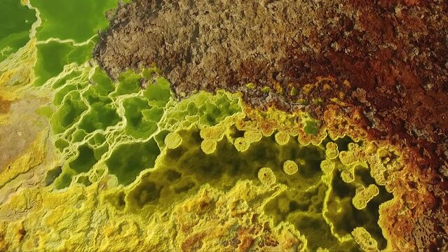 Volcanic crater lake. Dallol Geothermal area. Crystalline sulfides in an acid pool. Geothermal field of Danakil Depression. Hot springs and acid mineral in surreal landscape in Ethiopia, Africa