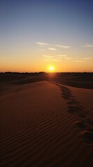 Fototapeta na wymiar a sunset over a desert