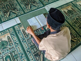 young men read the Koran in the mosque in the holy month of Ramadan