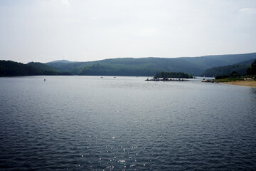 lake with boats and mountains