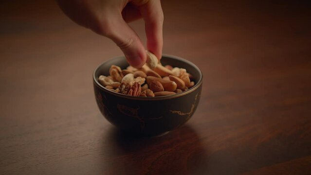 Mixed Nuts of Almonds Pecan Walnuts Cashews Hazelnuts on Wooden Table