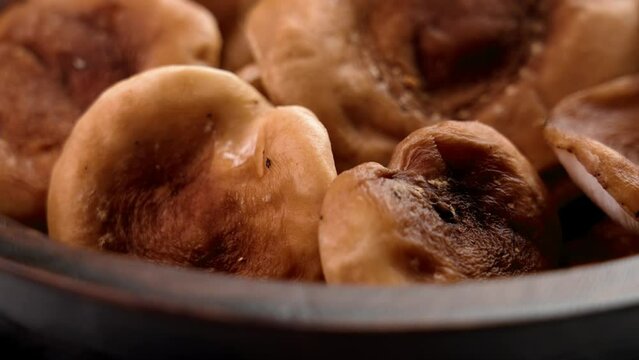 Raw shiitake mushrooms in wooden bowl close up. Healthy organic food. Rotation. Lentinula edodes