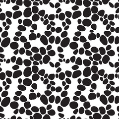 Pebble like black spots arranged in seamless pattern. Black stones repeated on white background, resembling road paved with cobblestones. Creative texture for printing or use in graphic design.