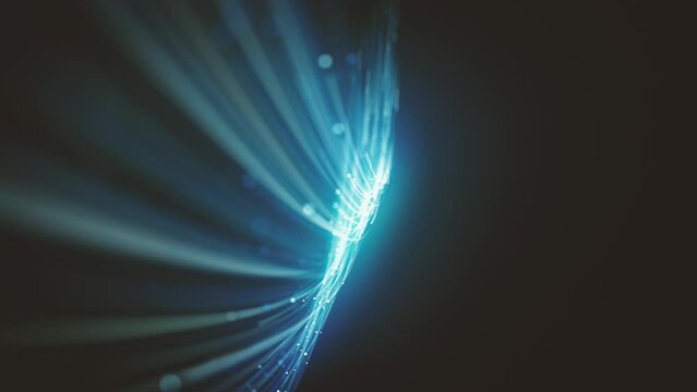Abstract Swirling And Flowing Lines Background/ 4k animation of an abstract technology background with waving light particles and depth of field blur