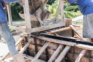 Concrete mix, Worker open cement bucket tank machine on fence frame steel structure floor concrete building site, Crane material equipment to high site