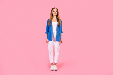 Full length photo of positive good mood lady dressed blue shirt walking empty space isolated pink color background