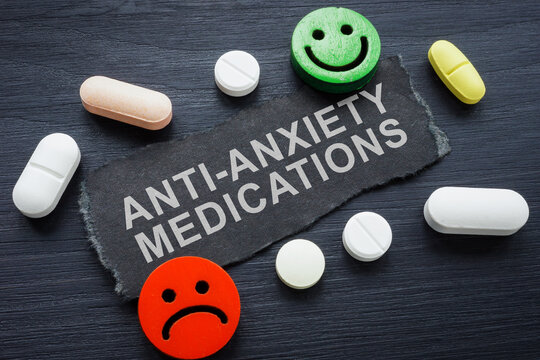 Pills, inscription anti-anxiety medications and emoticons.