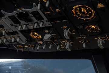 Aircraft dashboard with compass and buttons for place control. Avionic console boasts navigation...