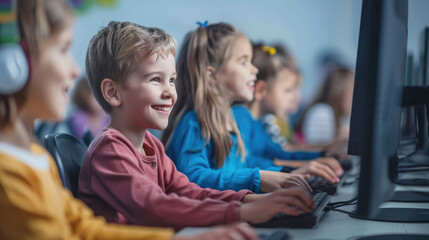 Diverse group of children sitting for learning computer at school classroom