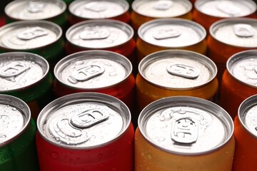 Energy drinks in wet cans, closeup. Functional beverage
